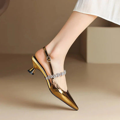 Gold metallic slingback pumps with rhinestone strap and mid block heel