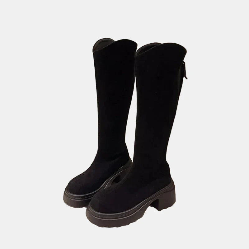 Black tall boots pair, suede-look upper, chunky sole and block heel, rounded toe