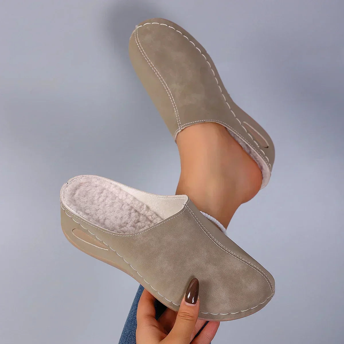 Taupe orthopedic slip-on slippers with beige lining, stitched moc toe and side cutout