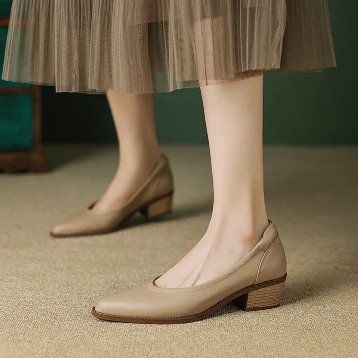 Apricot mid heeled shoes with pointed toe and low block heel, front view on foot