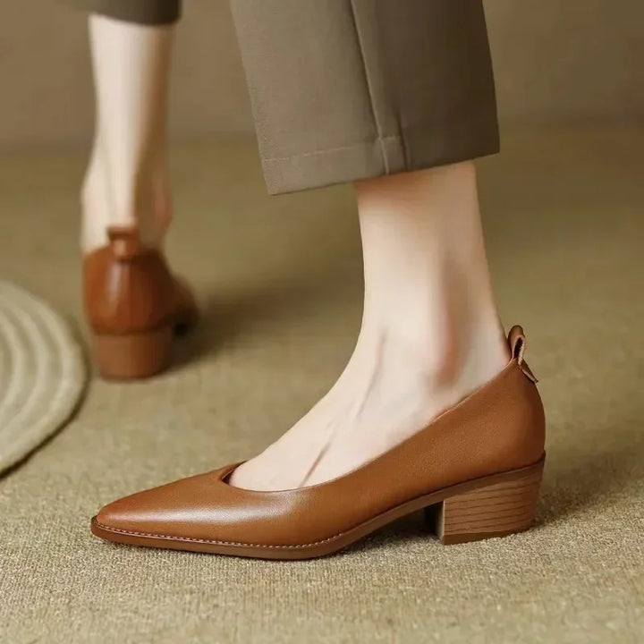 Brown leather slingback pumps with low block heel and rounded almond toe