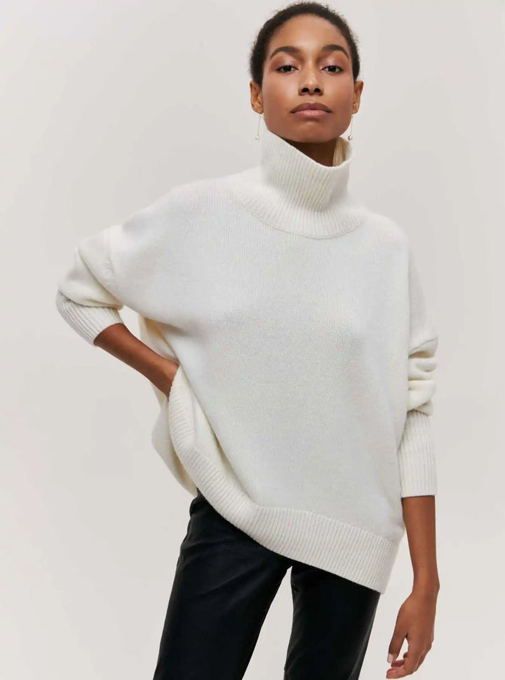 White turtleneck sweater with ribbed collar and cuffs, loose fit