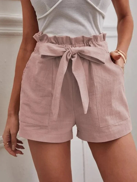 Blush pink paper-bag shorts with bow tie, ruffled elastic waist, side pockets.