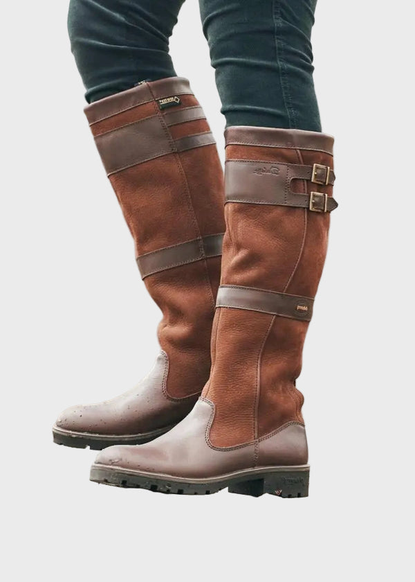 Dark brown high boots with wide strap buckles and rugged outsole