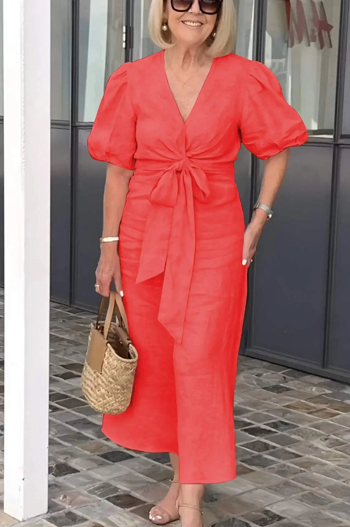 Red V-neck midi dress with puff sleeves and waist tie, front view