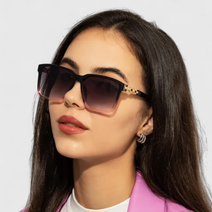Black square sunglasses with tinted gradient lenses and gold chain hinge detail