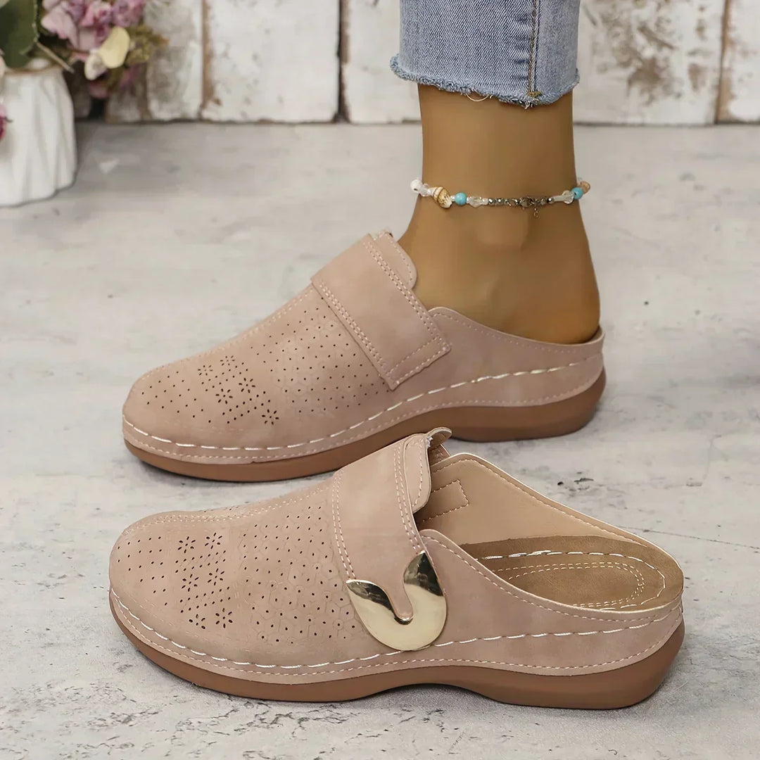 Pale pinkish-beige wedge mule sandals with perforated upper and strap closure
