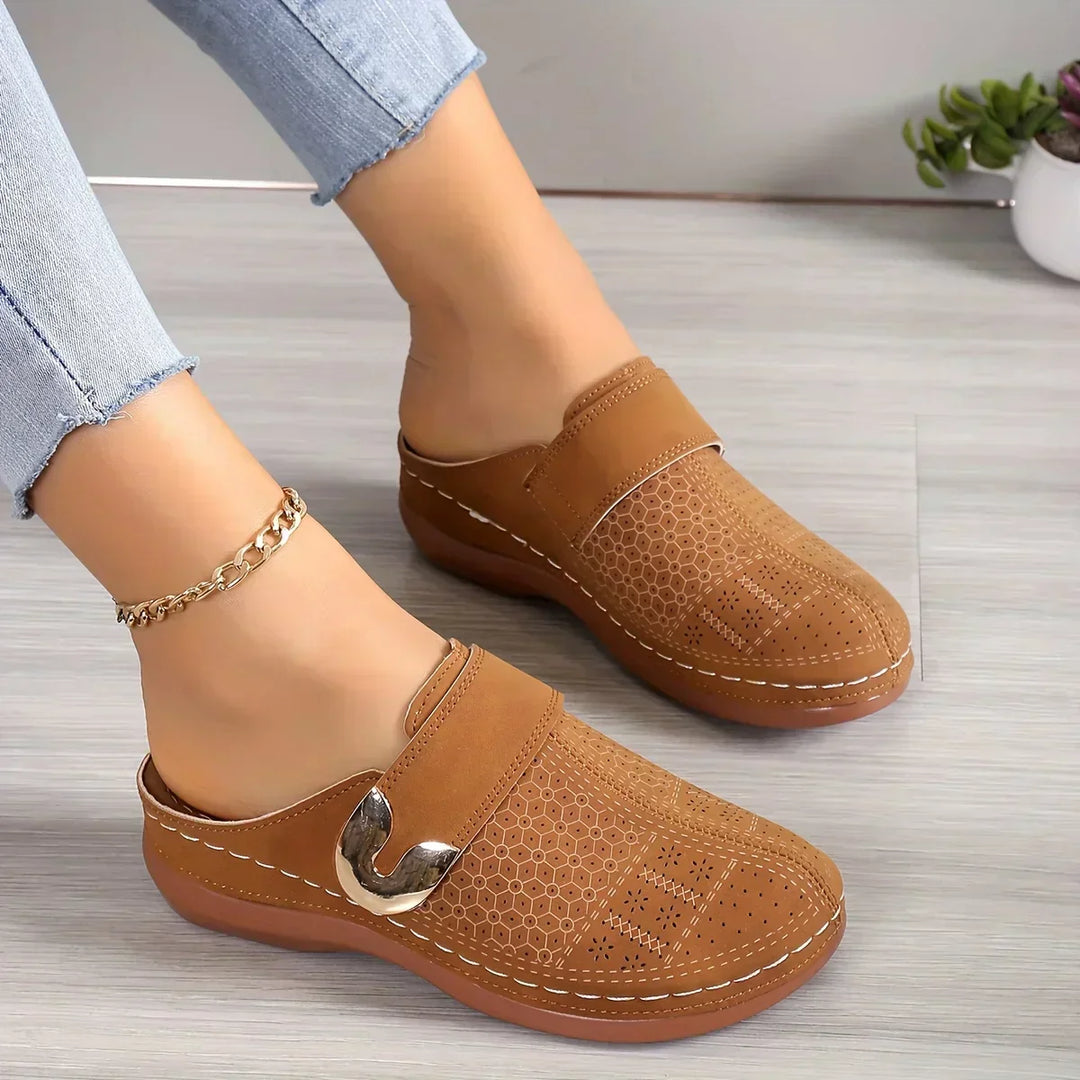 Light brown perforated wedge sandals with side strap and gold-tone buckle