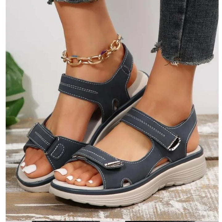 Navy orthopedic sandals with two hook-and-loop straps and white contrast stitching