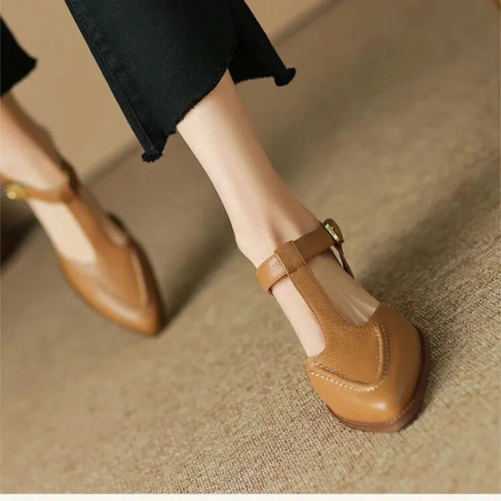 Tan buckle loafers with side strap and stitched toe, low block heel