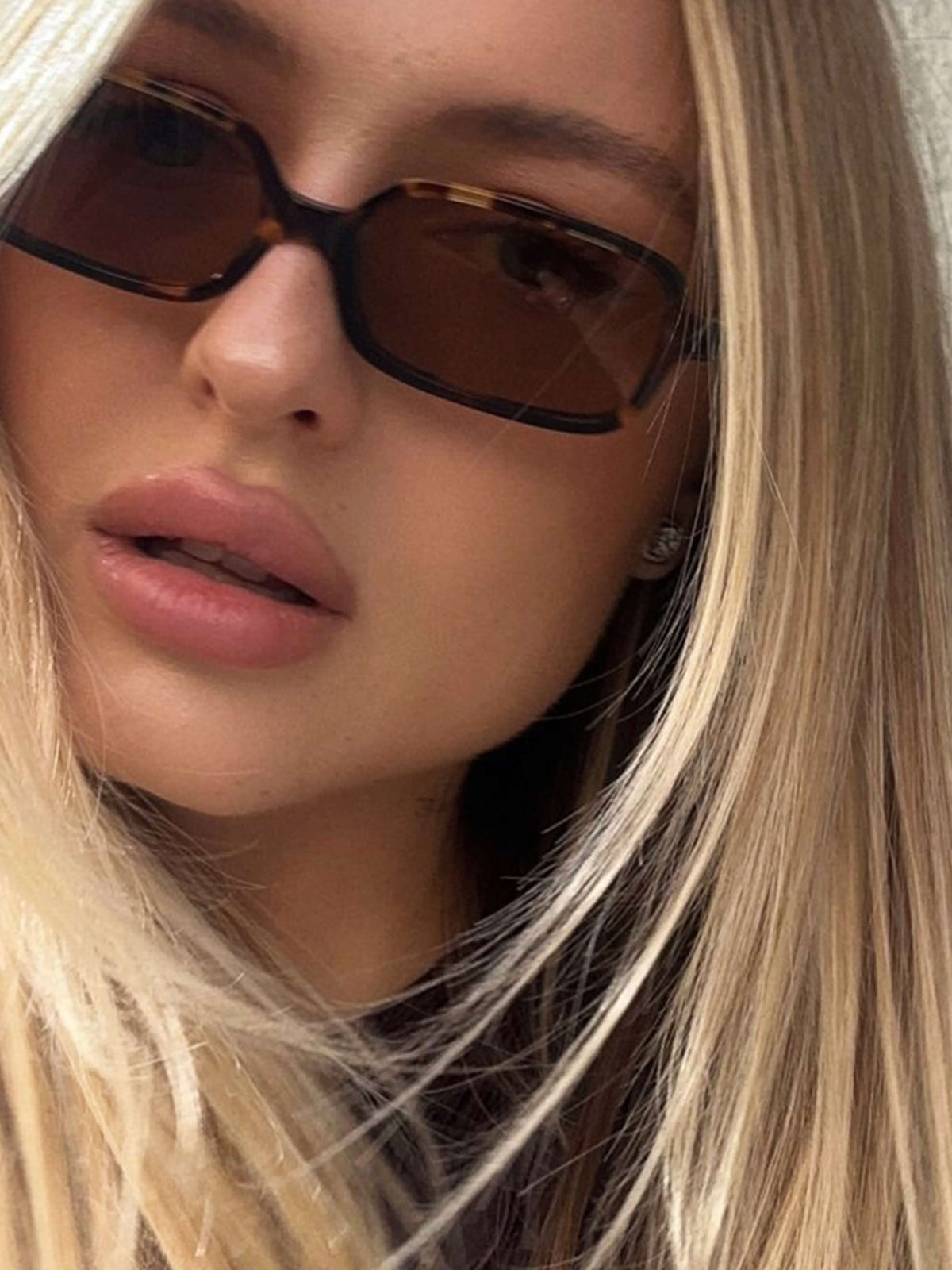 Close-up of tortoise square sunglasses with brown-tinted lenses