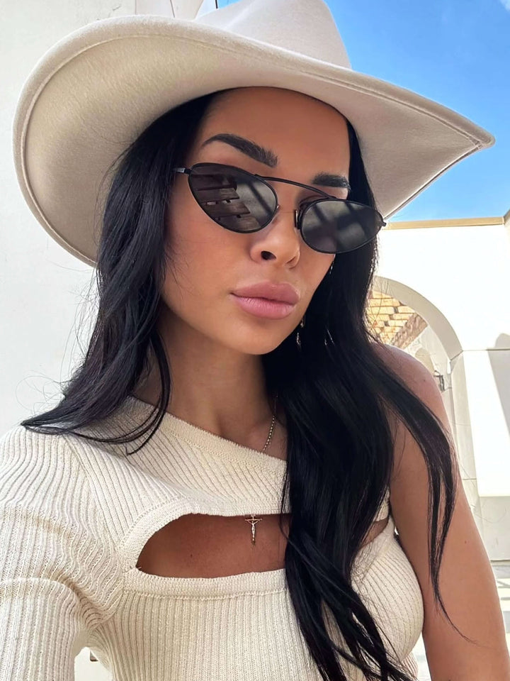 Black sunglasses with dark lenses and thin metal arms