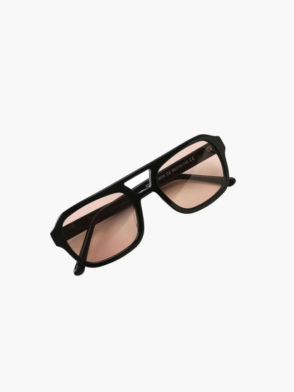 Black sunglasses with peach-tinted lenses and rectangular frames