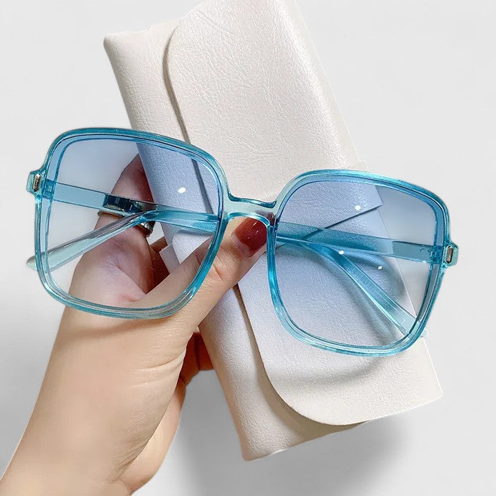 Blue square sunglasses with light blue tinted lenses and metal hinges