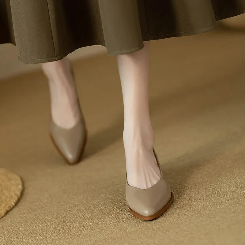 Classic pumps in beige leather-look with almond toe and low wooden block heel