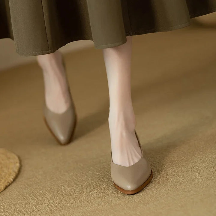Classic pumps in beige leather-look with almond toe and low wooden block heel