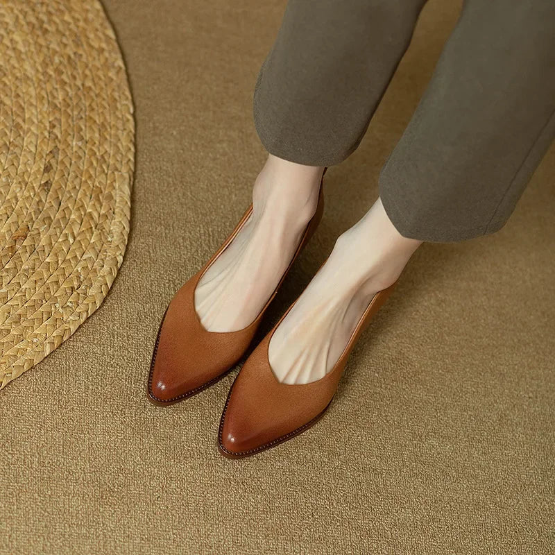 Classic pumps in brown leather-look with almond toe and low block heel, front angle
