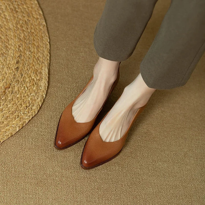 Classic pumps in brown leather-look with almond toe and low block heel, front angle