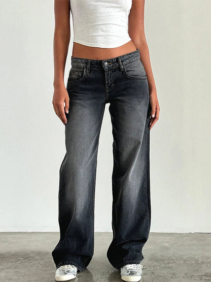 Dark gray baggy jeans on model: high-rise waist, button fly, and wide leg with cuffed hem.