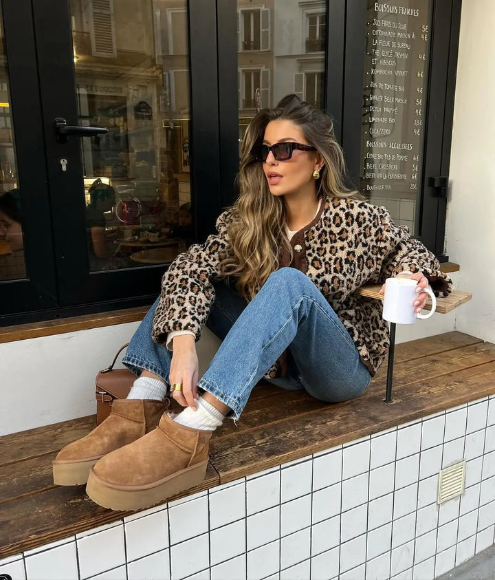 Leopard print cardigan with button front and long sleeves, laid back relaxed style
