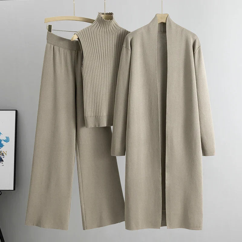 Khaki three-piece set: ribbed sleeveless turtleneck top, wide-leg pants, long cardigan