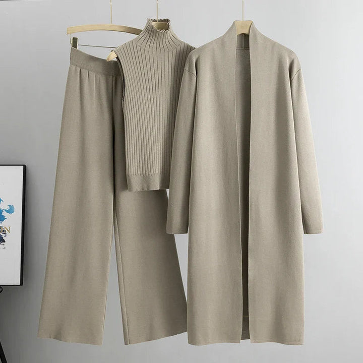 Khaki three-piece set: ribbed sleeveless turtleneck top, wide-leg pants, long cardigan