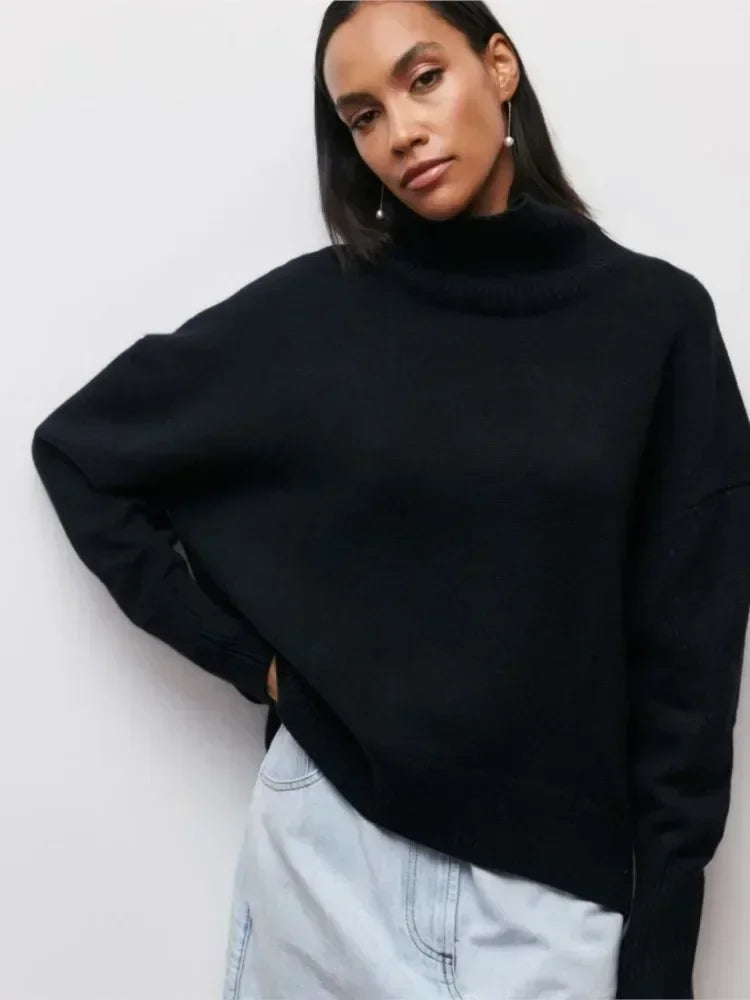 Black turtleneck sweater with long sleeves and ribbed collar and cuffs