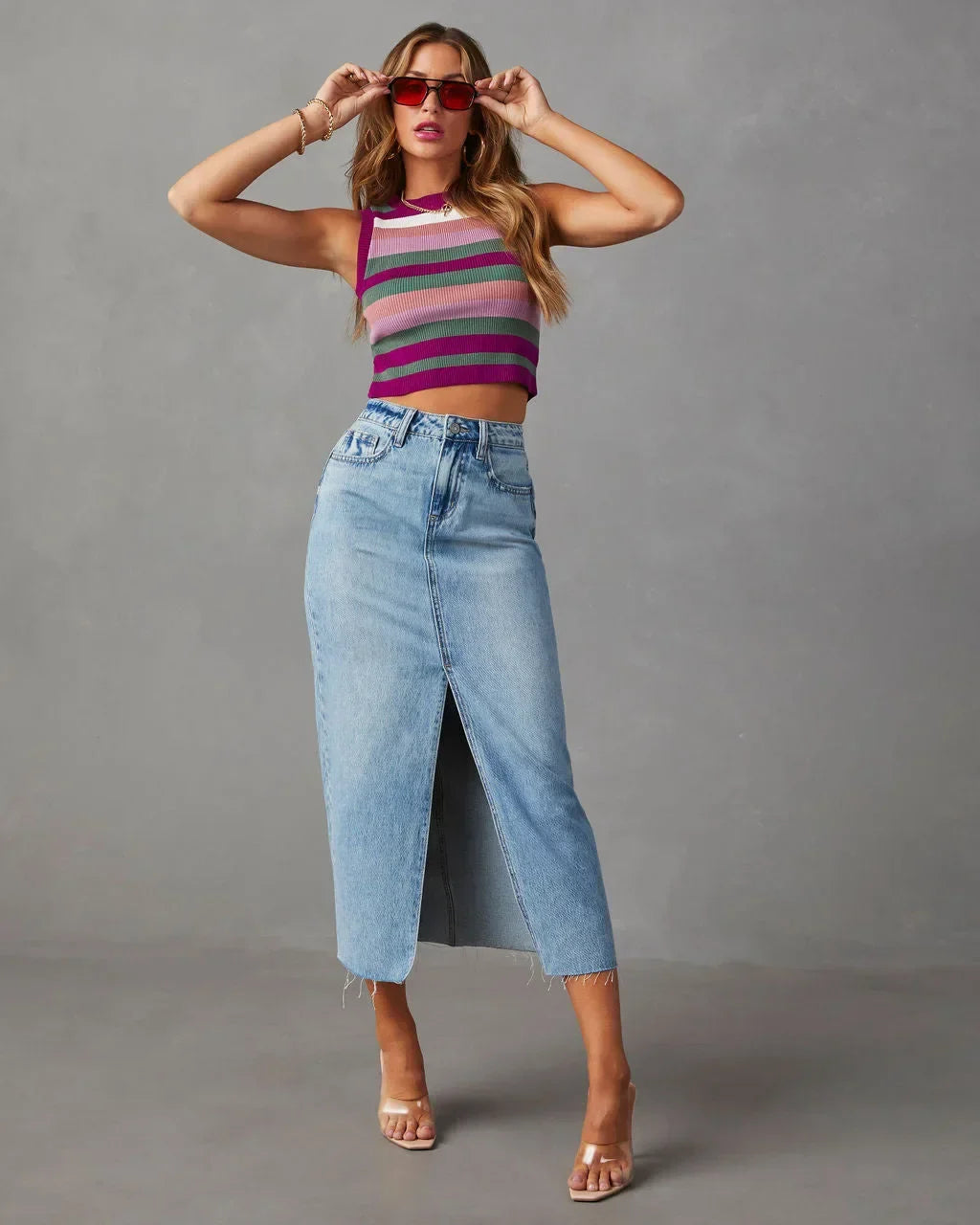 Light blue high-waist denim midi skirt with front slit and frayed hem
