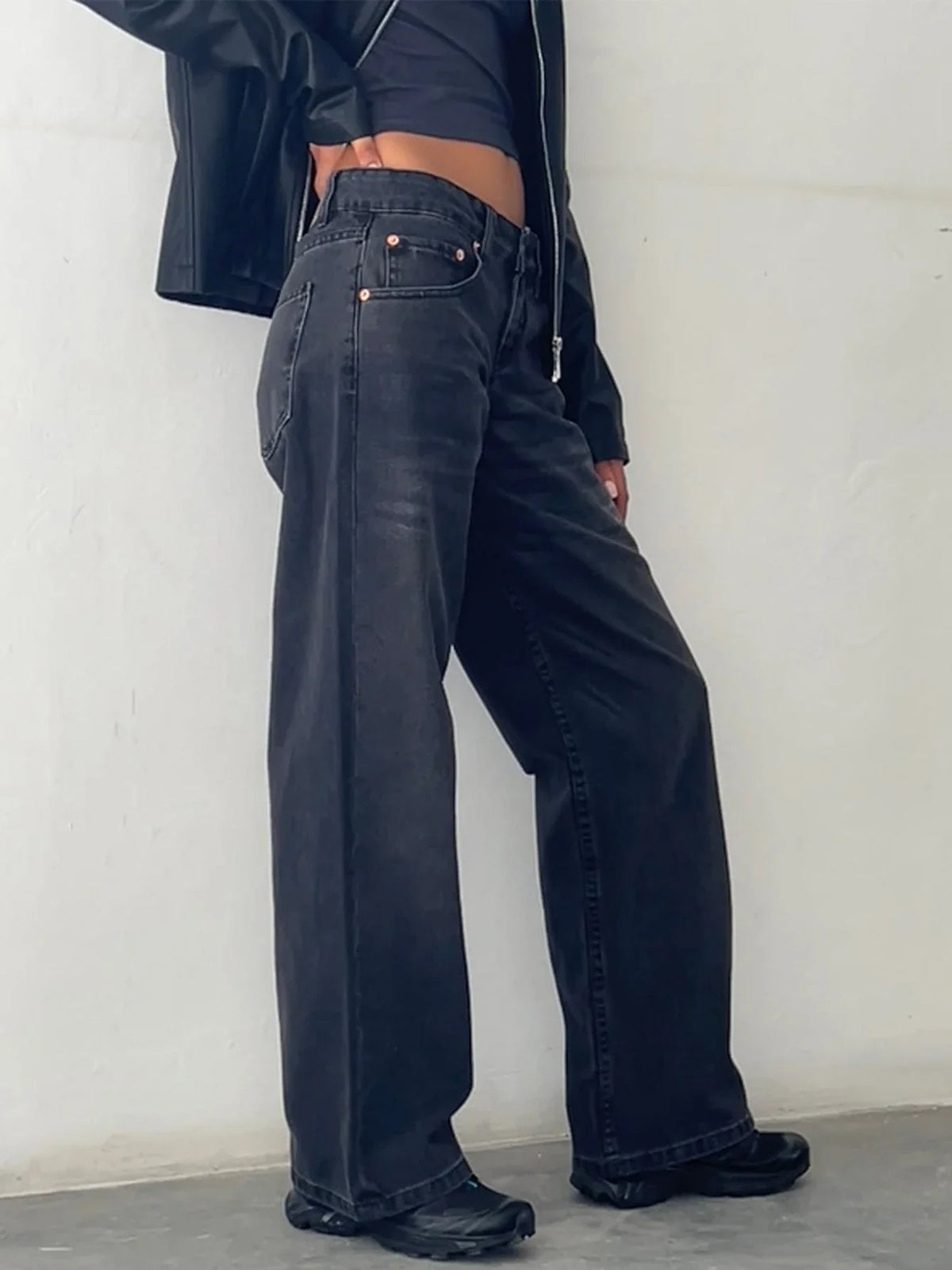Washed dark baggy jeans with front button closure and five-pocket styling