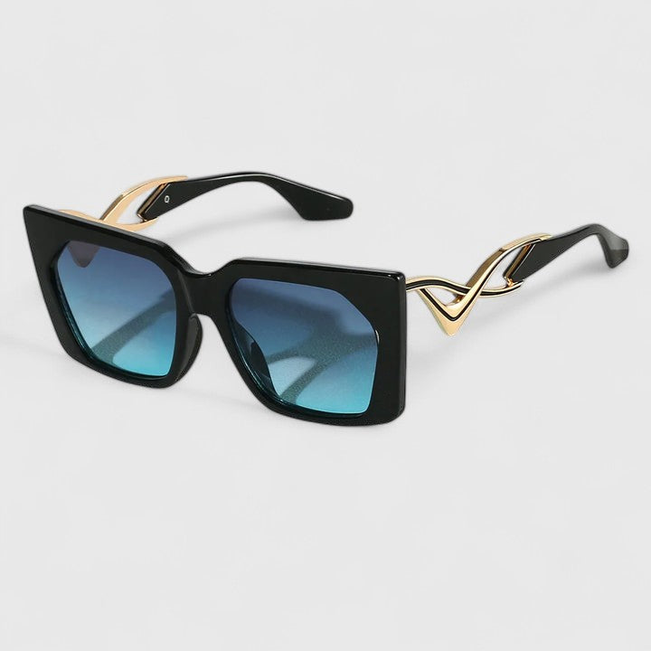 Cat-eye sunglasses with black frame and blue tinted gradient lenses