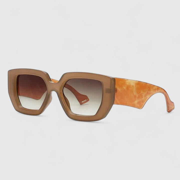 Brown oversized square sunglasses with amber tinted lenses and orange patterned temple arm