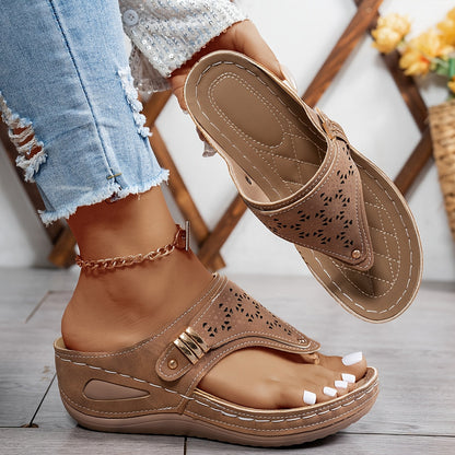 Brown orthopedic sandals with perforated upper and double buckle ankle strap
