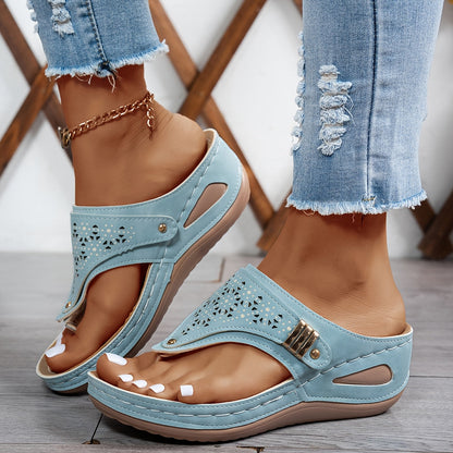 Light blue orthopedic sandals with perforated straps and cushioned contoured sole