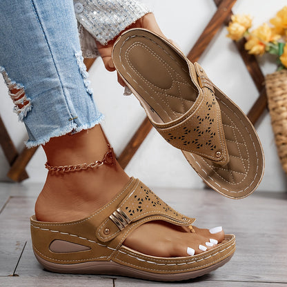 Brown orthopedic sandals with perforated toe strap and adjustable double buckle closure