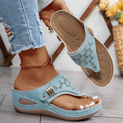 Light blue orthopedic sandals with perforated toe strap and double buckle closure