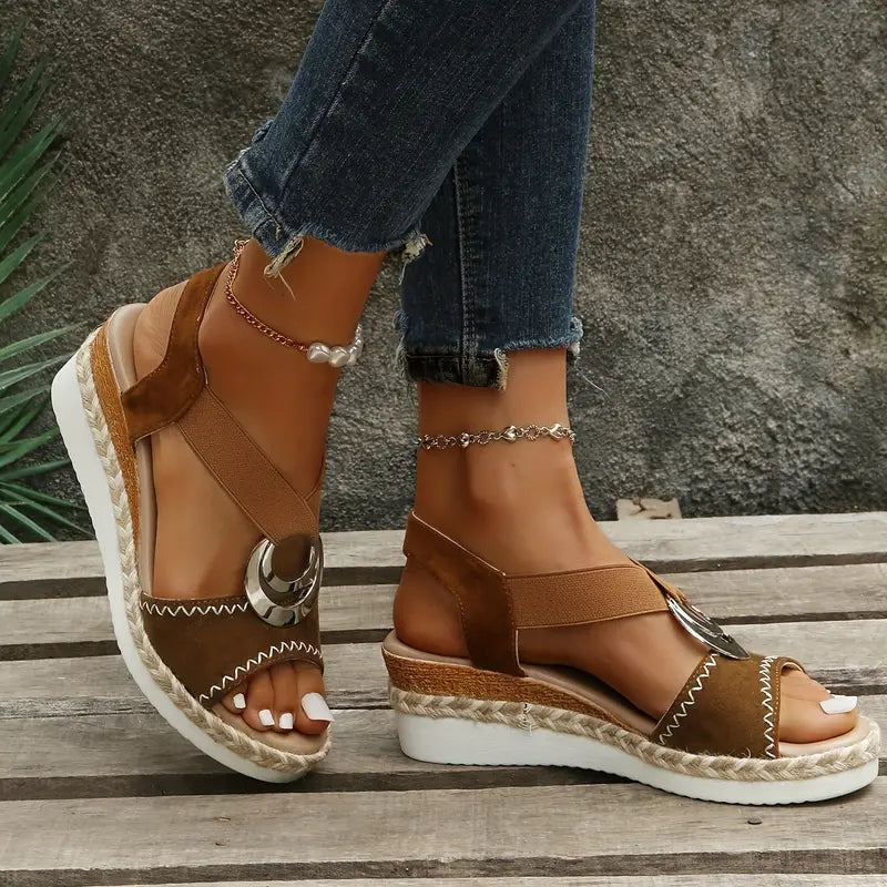 Brown platform espadrille sandals with cross straps, ankle strap, and metal ring buckle