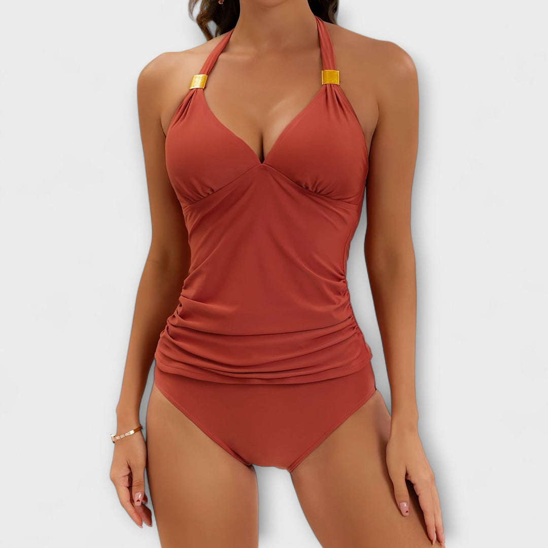 Red-orange halter two-piece swimsuit with ruched tank top and high-cut bikini bottoms