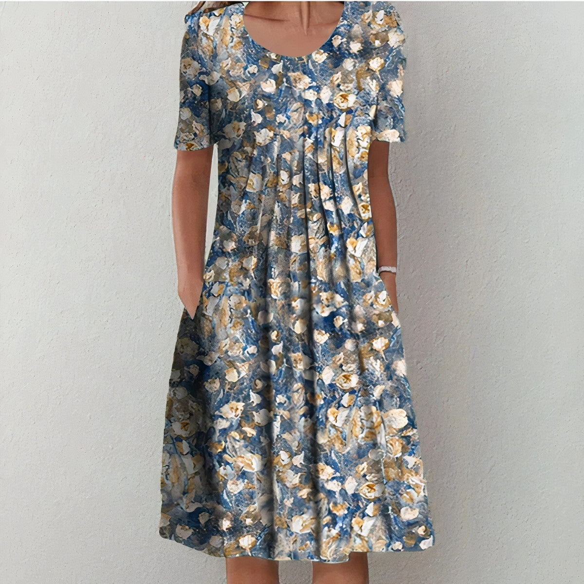 Blue floral midi dress with scoop neck, short sleeves, and A-line skirt in beige