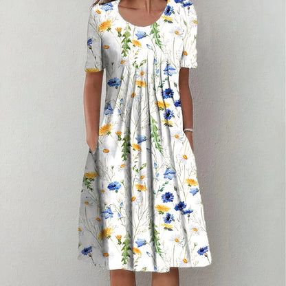 White floral midi dress with scoop neck, short sleeves, and gathered A-line skirt