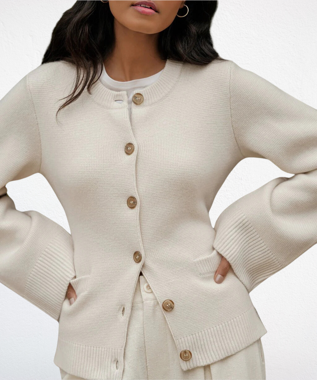 Cream cardigan sweater with button front and ribbed cuffs and hem