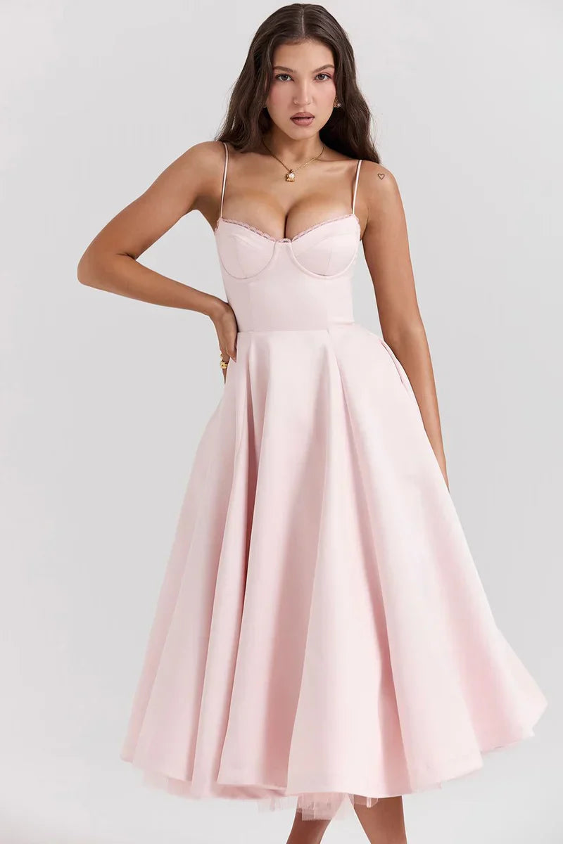 Blush pink tulle accent dress with spaghetti straps, sweetheart bodice, and flared skirt
