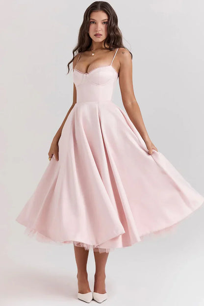 Blush pink satin midi dress with thin straps, sweetheart neckline, and flared skirt