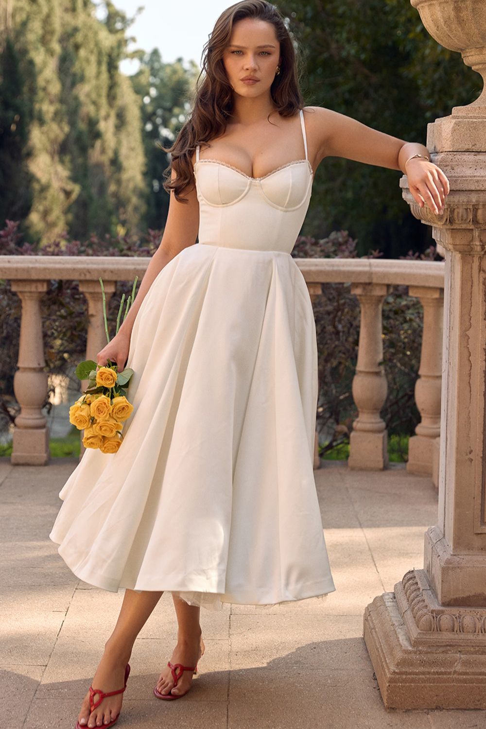 Cream satin midi dress with sweetheart bodice, thin straps, and layered tulle skirt