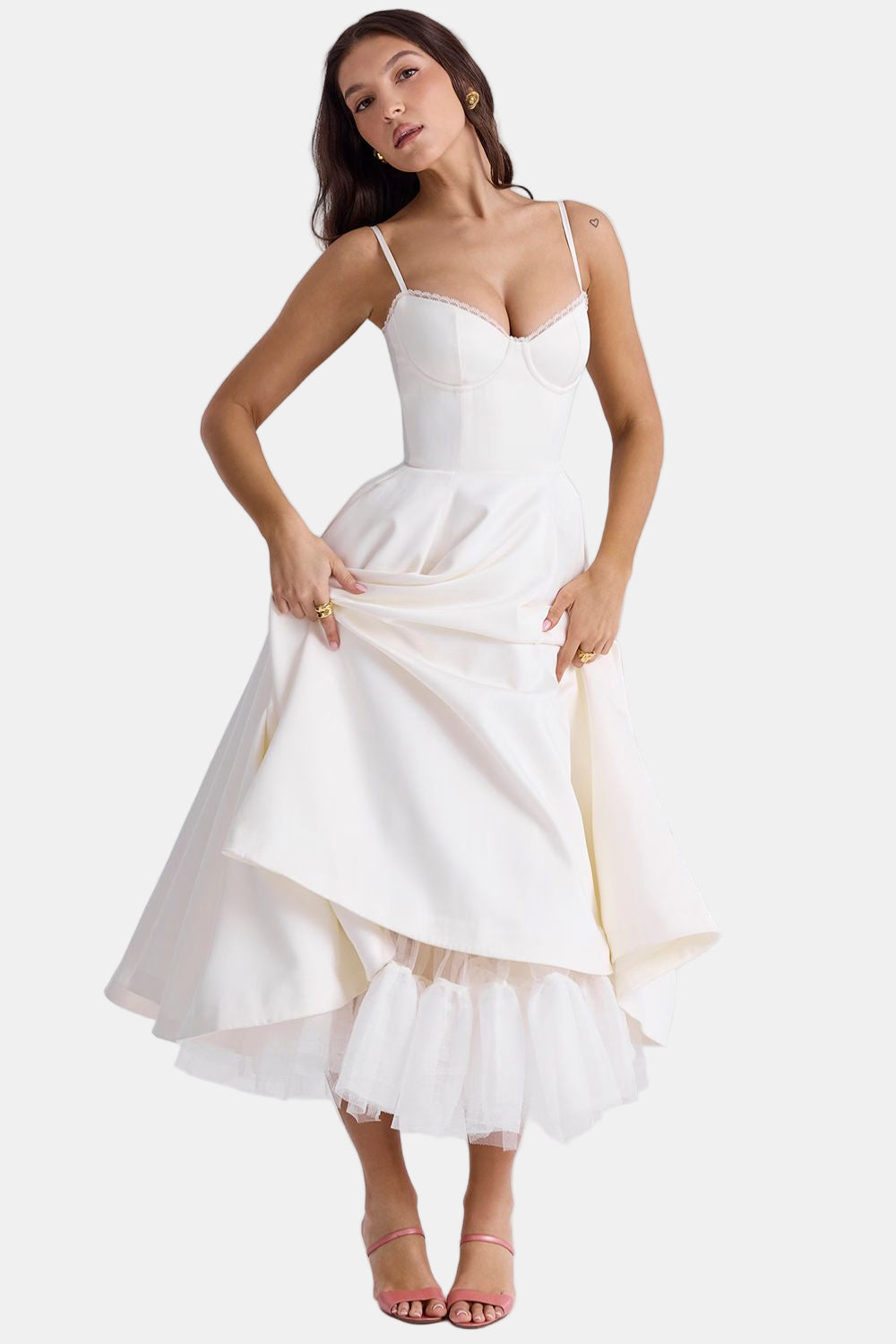 White satin dress with spaghetti straps, sweetheart bodice, and layered tulle hem