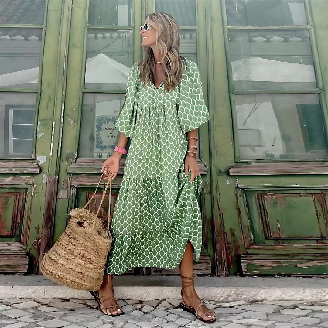 Green patterned spring dress with white geometric trellis, elbow sleeves and V neckline