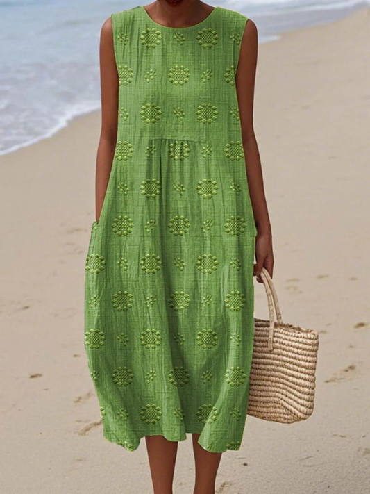 Green sleeveless midi dress with textured floral embroidery and tiered skirt