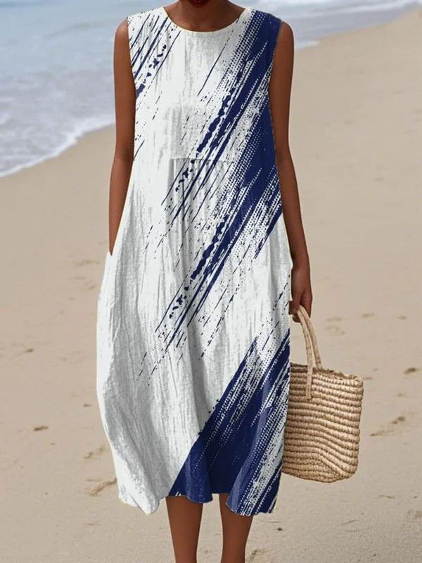 Sleeveless midi dress with white base and navy diagonal brushstroke print