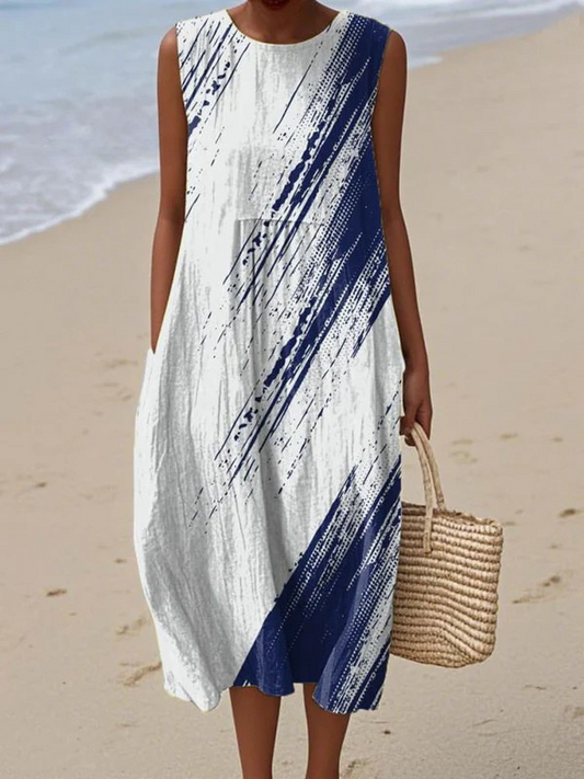 Sleeveless midi dress with white base and navy diagonal brushstroke print