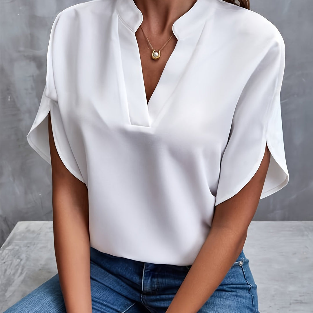 White women’s luxe flared top with V-neck and draped short sleeves