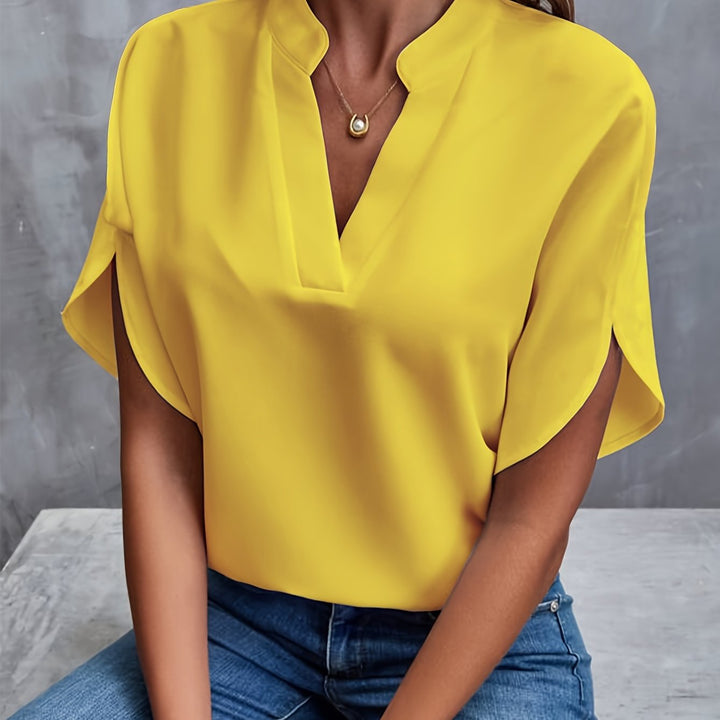 Yellow women’s luxe flared top with V-neck and draped short sleeves